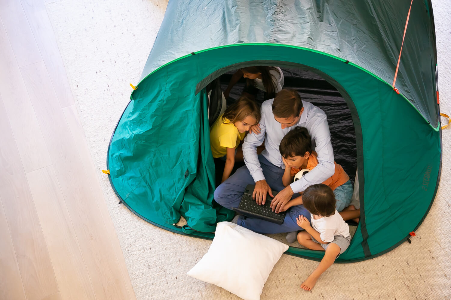 Indoor camping father with kids