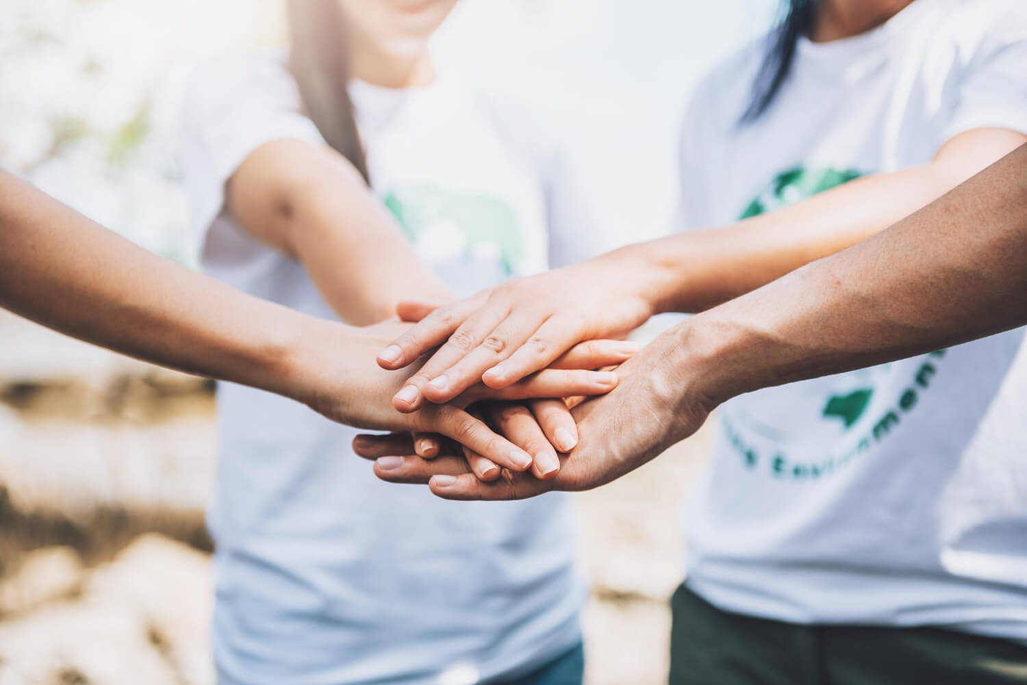 Close up of people volunteer teamwork putting finger on star shapehands together