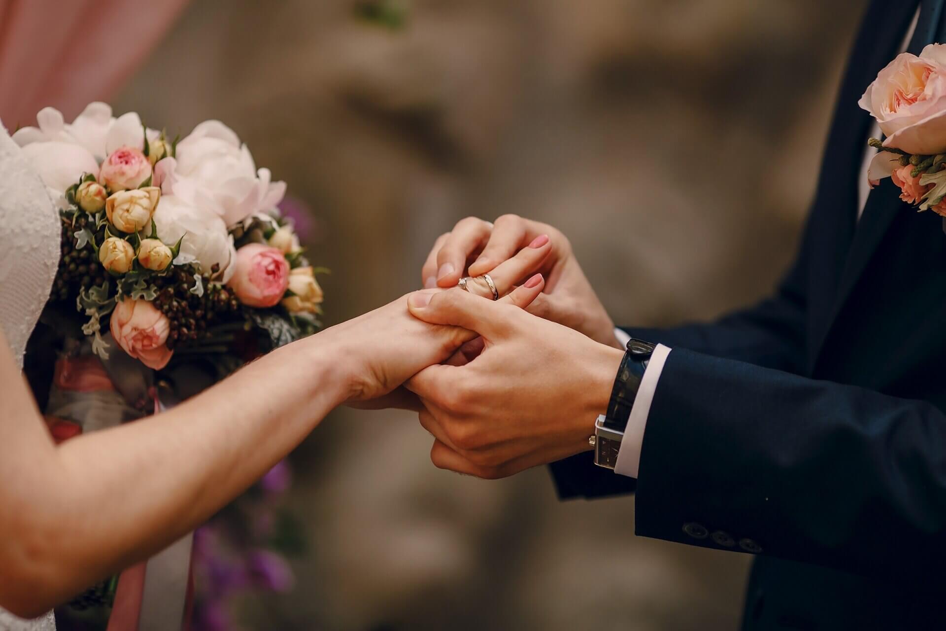 Groom putting ring bride s finger 1157 338