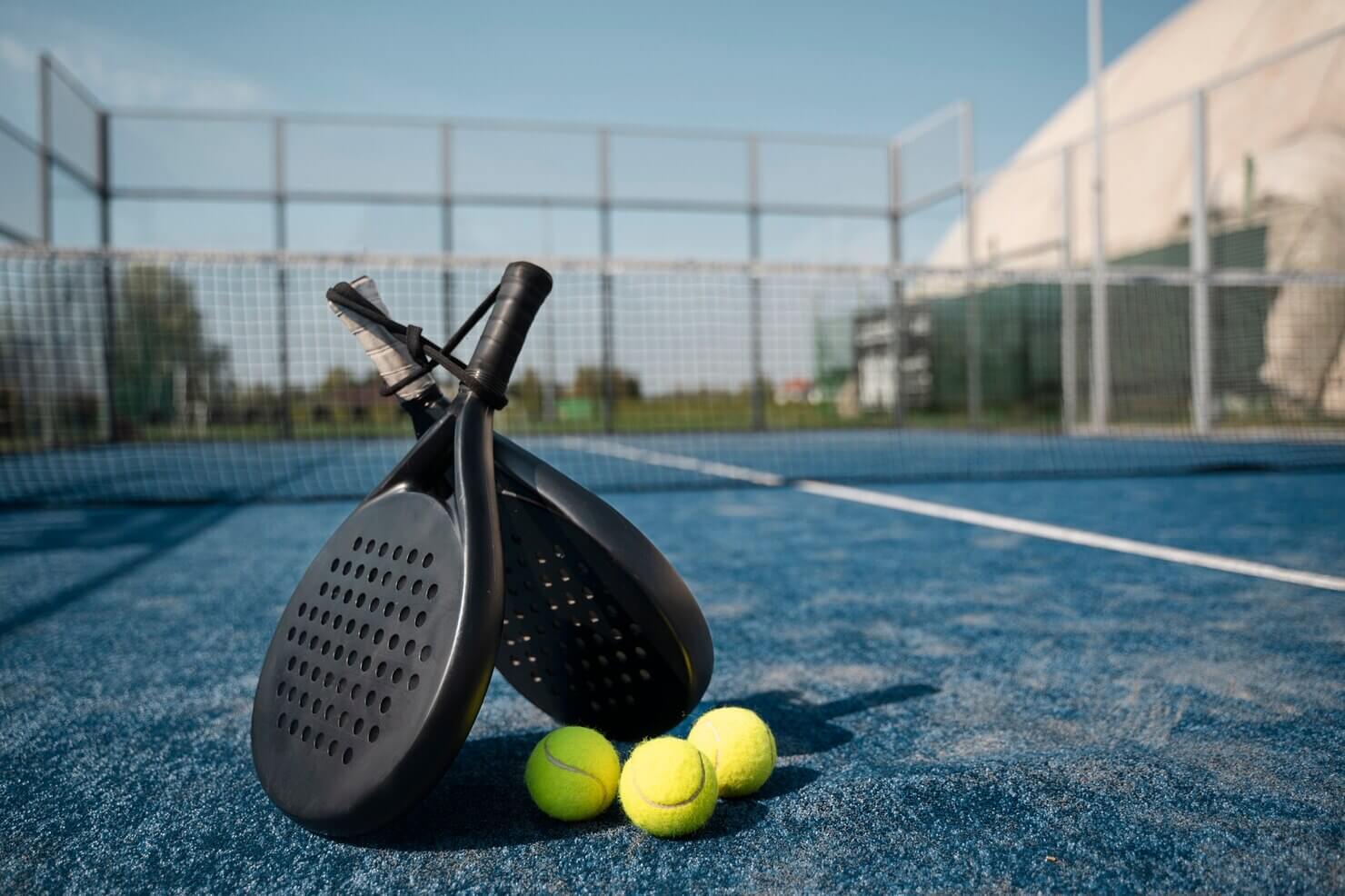 Tennis paddles balls arrangement