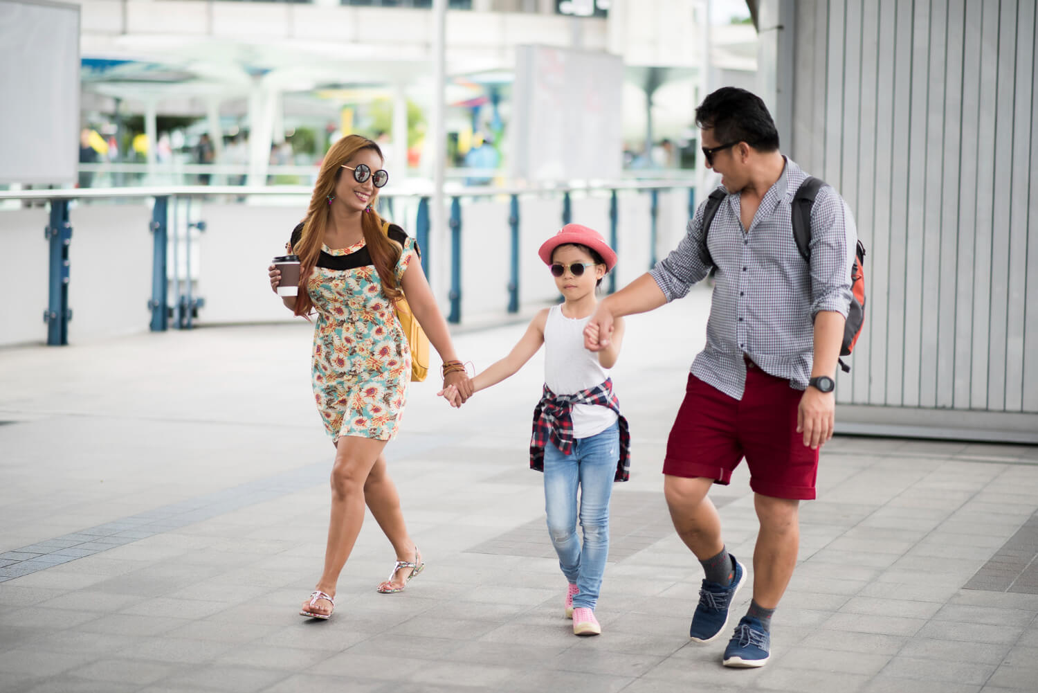 Happy stylish parent with daughter traveling